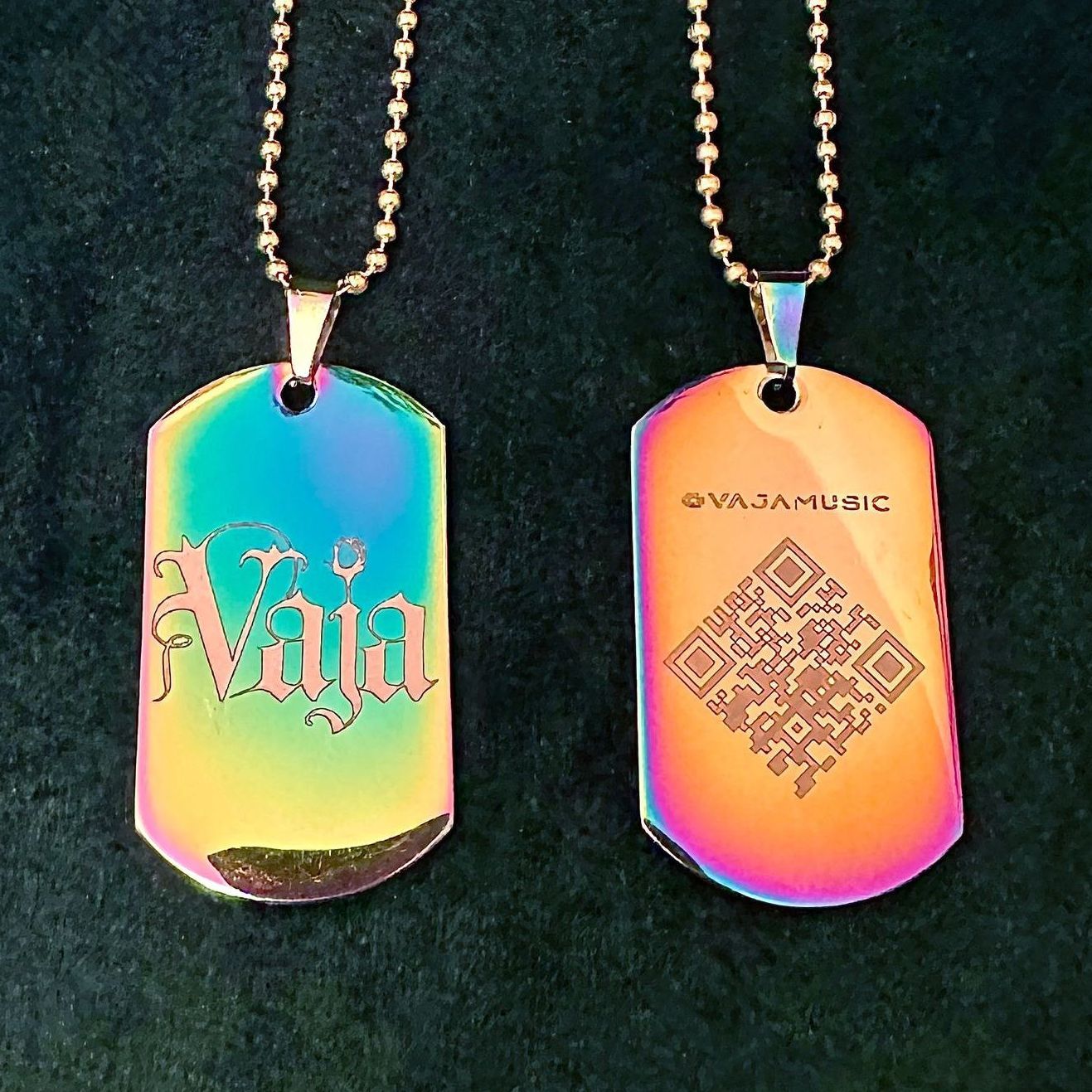 Dragon Fire glossy Vaja dog tags with a silver Vaja logo and gold chain.