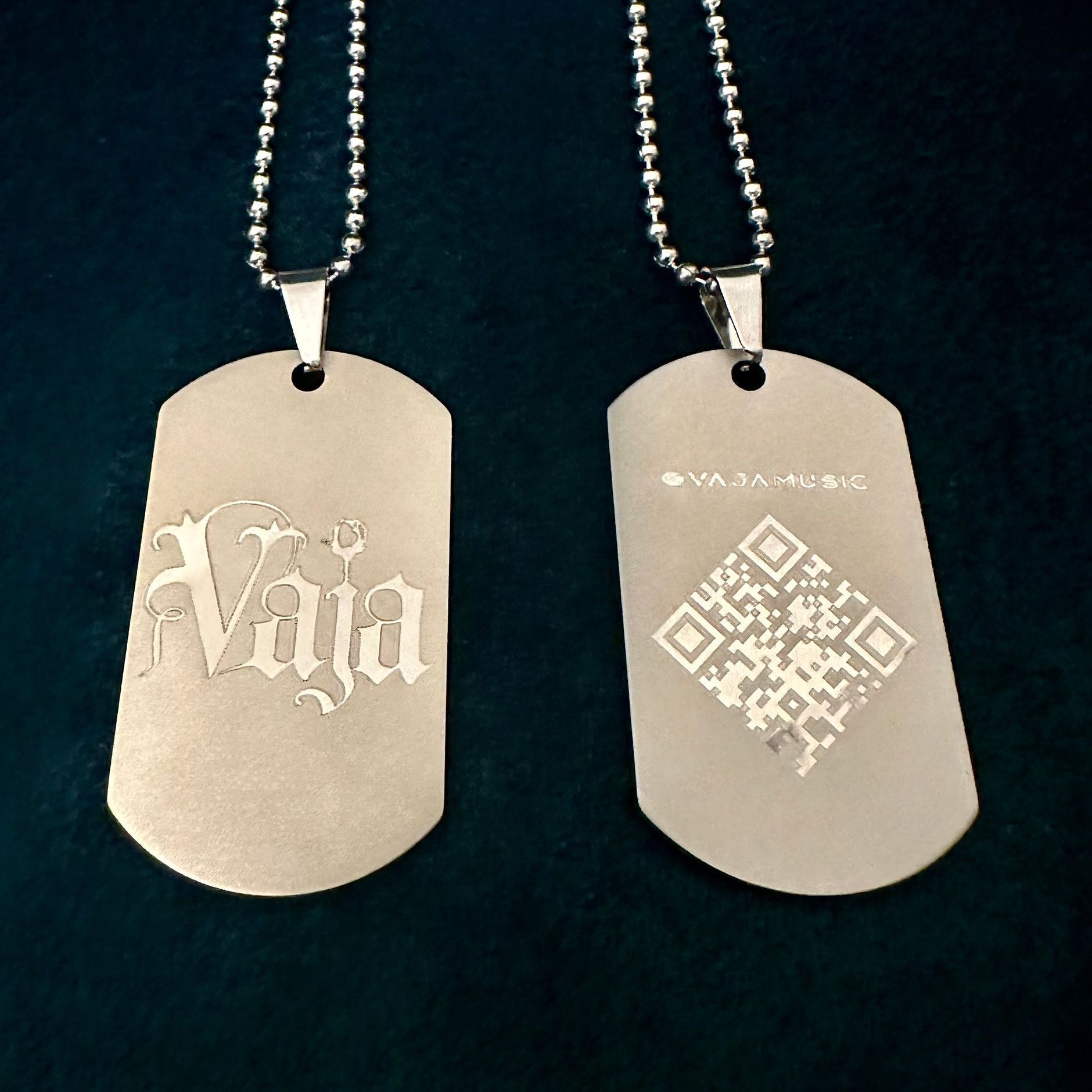 Silver matte Vaja dog tags with a silver chain.