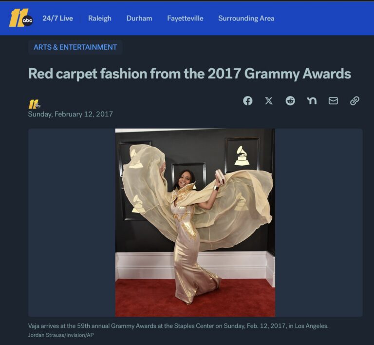 ABC11 article screenshot: Vaja in a gold gown with a flowing sheer cape on the red carpet at the 59th Grammy Awards in 2017.